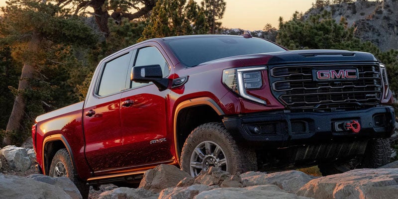 Red 2026 GMC Sierra 1500 Parked in the middle of the Off-road
